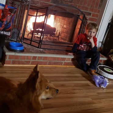 Kids near fireplace at drop-in childcare center serving Washington and Texas